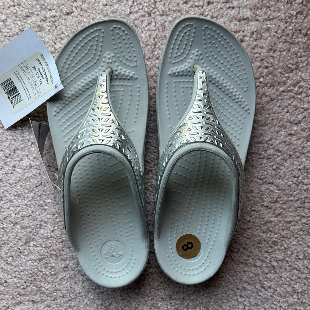 NWT.  Crocs Women's Silver Comfort Thong Sandals - Size 8